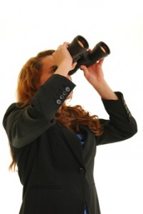 image of woman looking into binoculars
