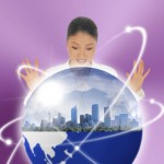 Image of business woman looking into globe