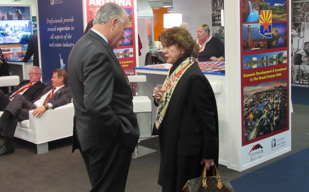 IAR Immediate Past President Jim Kinney meets with a visitor at MIPIM 2016. 