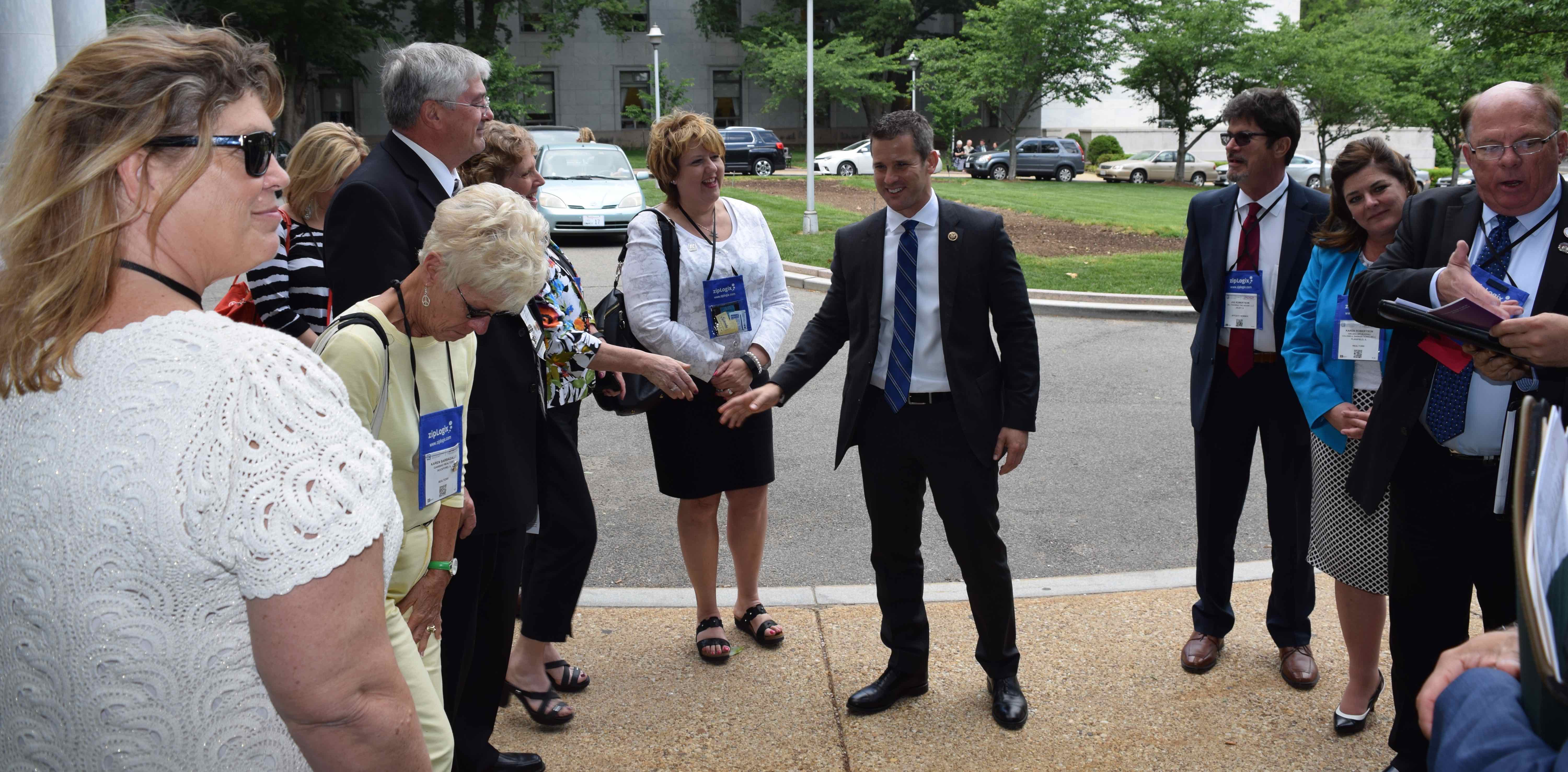 Illinois REALTORS® including FPC Ed Neaves meet with U.S. Rep Adam Kinzinger outside his Washington, D.C., office during Capitol Hill visits in May 2015.