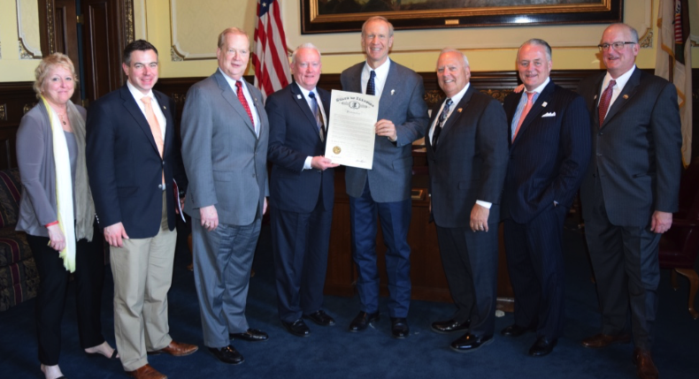 Gov. Bruce Rauner poses with Illinois REALTORS® representatives at a meeting at the Illinois Capitol on April 5, 2016. L-R are: Illinois REALTOR® Assistant Director for Legislative and Political Affairs Julie Sullivan, Treasurer Matt Difanis, President-elect Doug Carpenter, President Mike Drews, Gov. Rauner, CEO Gary Clayton, Immediate Past President Jim Kinney and Director of Government Affairs Greg St. Aubin.