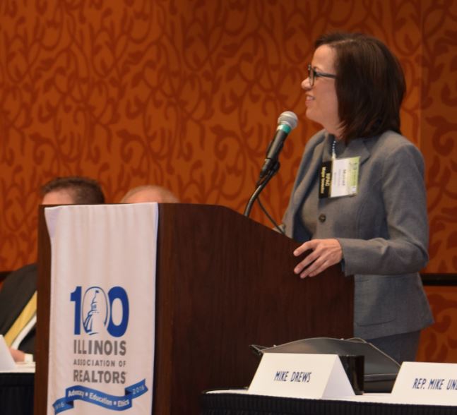 Mabél Guzmán leads the REALTORS® Political Involvement Committee held in Peoria in January, 2016. She has played a prominent role in local, state and national REALTOR® assocaition governance.