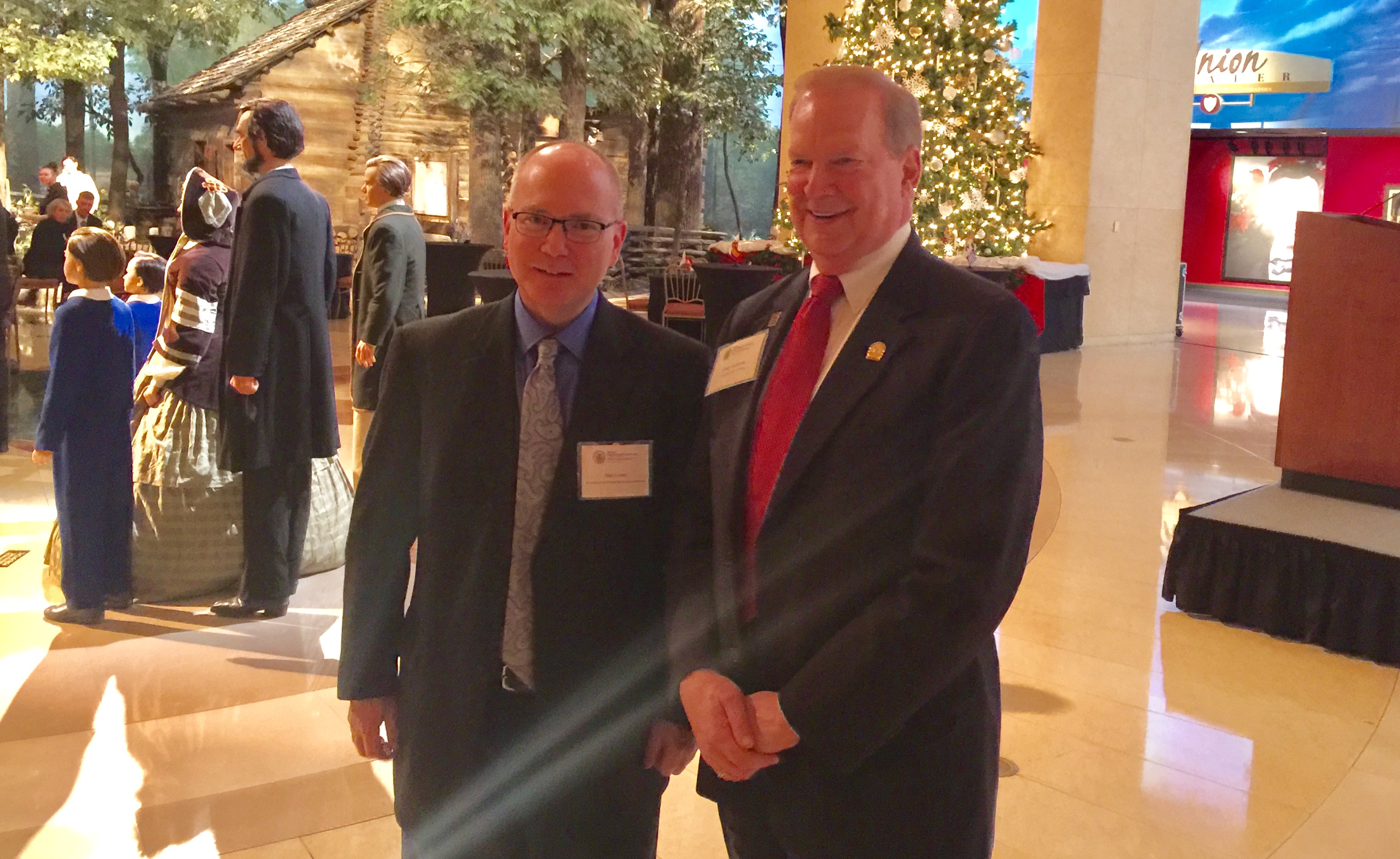 Alan Lowe, director of the Abraham Lincoln Presidential Library and Museum, with Doug Carpenter, Illinois REALTORS® president. The association sponsored a reception for the Illinois Department of Commerce and Economic Opportunity on Thursday, Dec. 8, 2016.