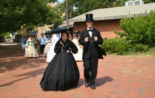 Abraham Lincoln and Mary Todd Lincoln walk to Bicentennial Plaza