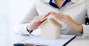 title insurance hands protecting house