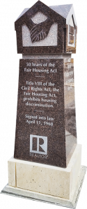 A monument commemorating the federal Fair Housing Act stands in Bicentennial Plaza — A REALTOR® Community Partnership, outside the association's Springfield headquarters.