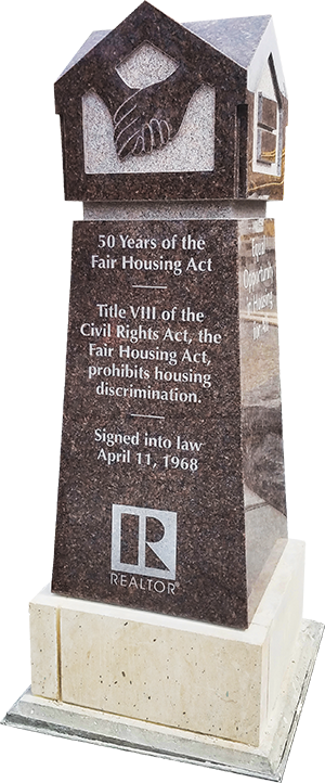 A monument commemorating the federal Fair Housing Act stands in Bicentennial Plaza — A REALTOR® Community Partnership, outside the association's Springfield headquarters.