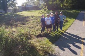 REALTORS cut down weeds