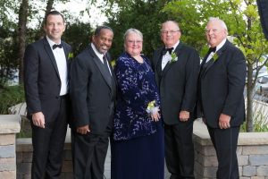 Left to right: Illinois REALTORS® Deputy CEO Jeffrey T. Baker, Treasurer Zeke Morris, President-elect Sue Miller, President Ed Neaves and CEO Gary Clayton