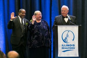 Treasurer Zeke Morris (left) and President-elect Sue Miller (center) are sworn-in