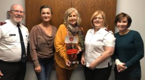 Fox Valley REALTORS® and Salvation Army leaders together for bell ringing project