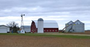 a barn, a silo, a windmill and other farm buildings