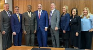 Group photo of National Association of REALTORS® leaders and HUD Secretary Ben Carson.