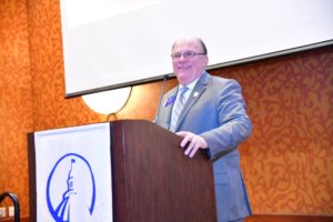 Ed Neaves at podium