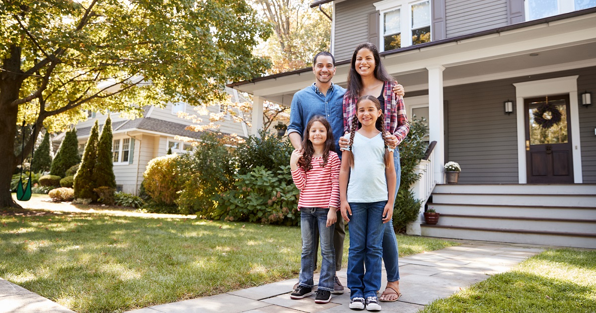 photo of smiling family of four